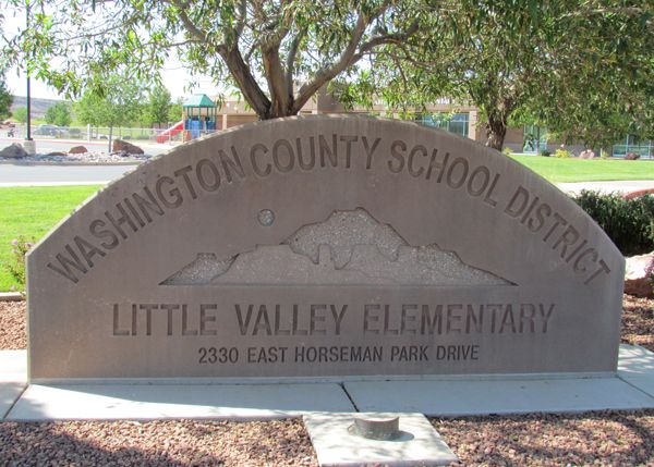 Concrete sign that says Washington County School District and the Name and address for Little Valley Elementary